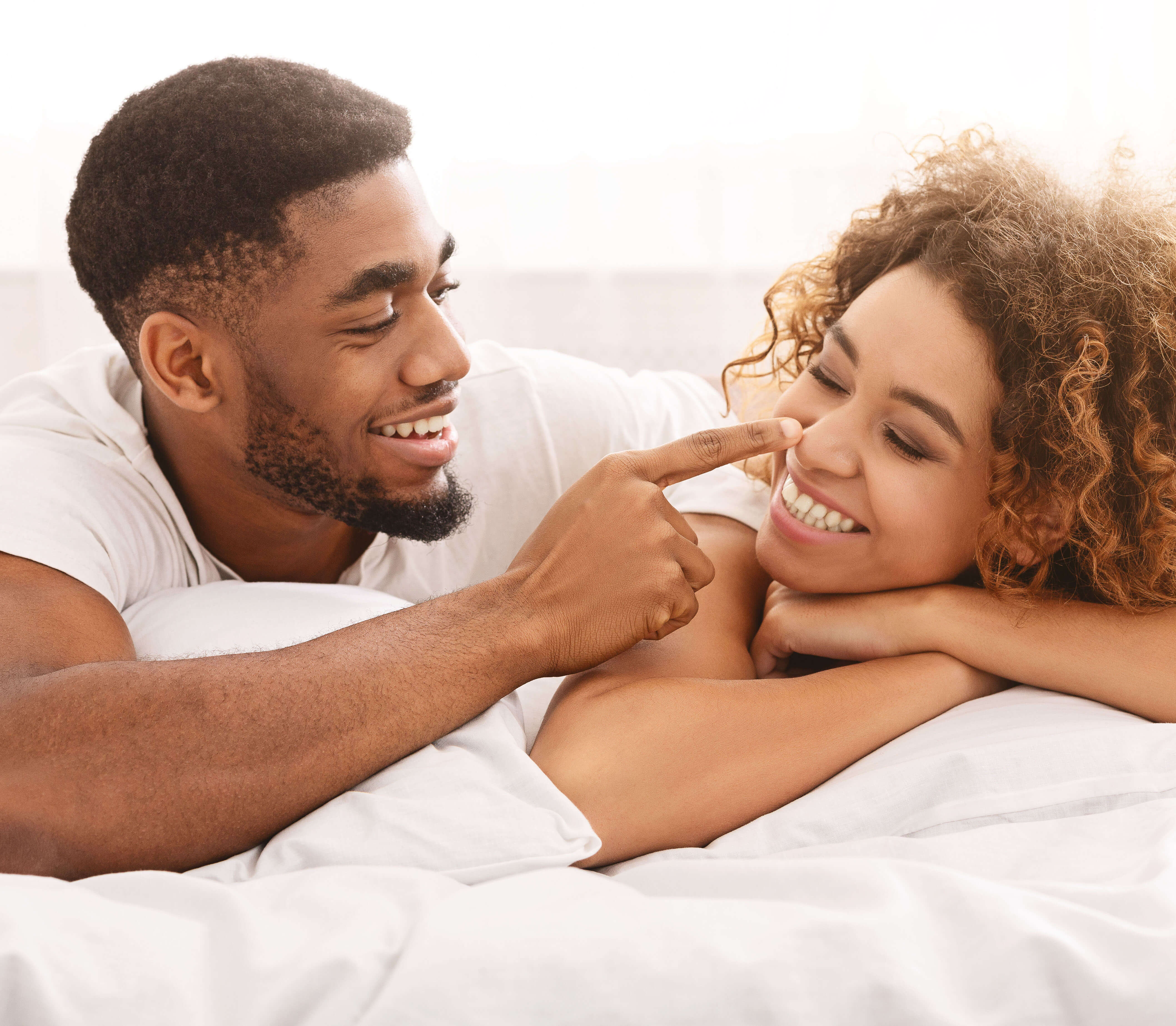 Smiling couple relaxing together, Feel Your Best wellness treatments