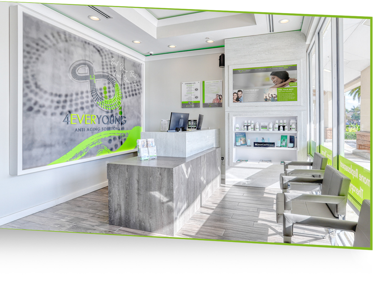 The modern reception area of a 4EverYoung beauticlinic featuring product displays and a bright, welcoming interior.