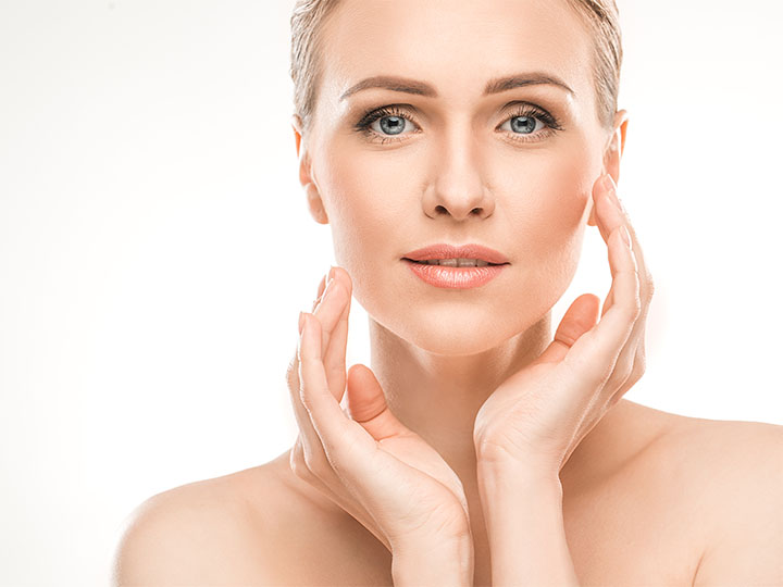 Jaw Botox results shown on a woman with smooth, contoured lower face and clear skin.