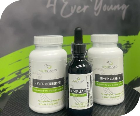 Three 4Ever Young branded dietary supplements — 4Ever Berberine, 4EverLean drops, and 4Ever Carb-X — displayed together on a branded mat.