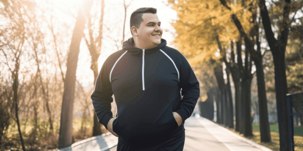 Appetite suppressant medication benefits illustrated by a man walking outdoors looking motivated and energetic.