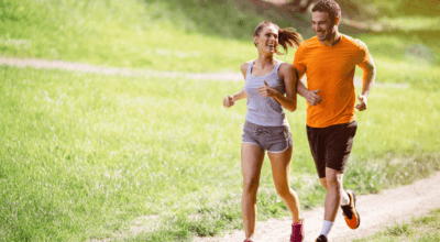 Active couple jogging outdoors, possibly seeing results from semaglutide for weight loss.